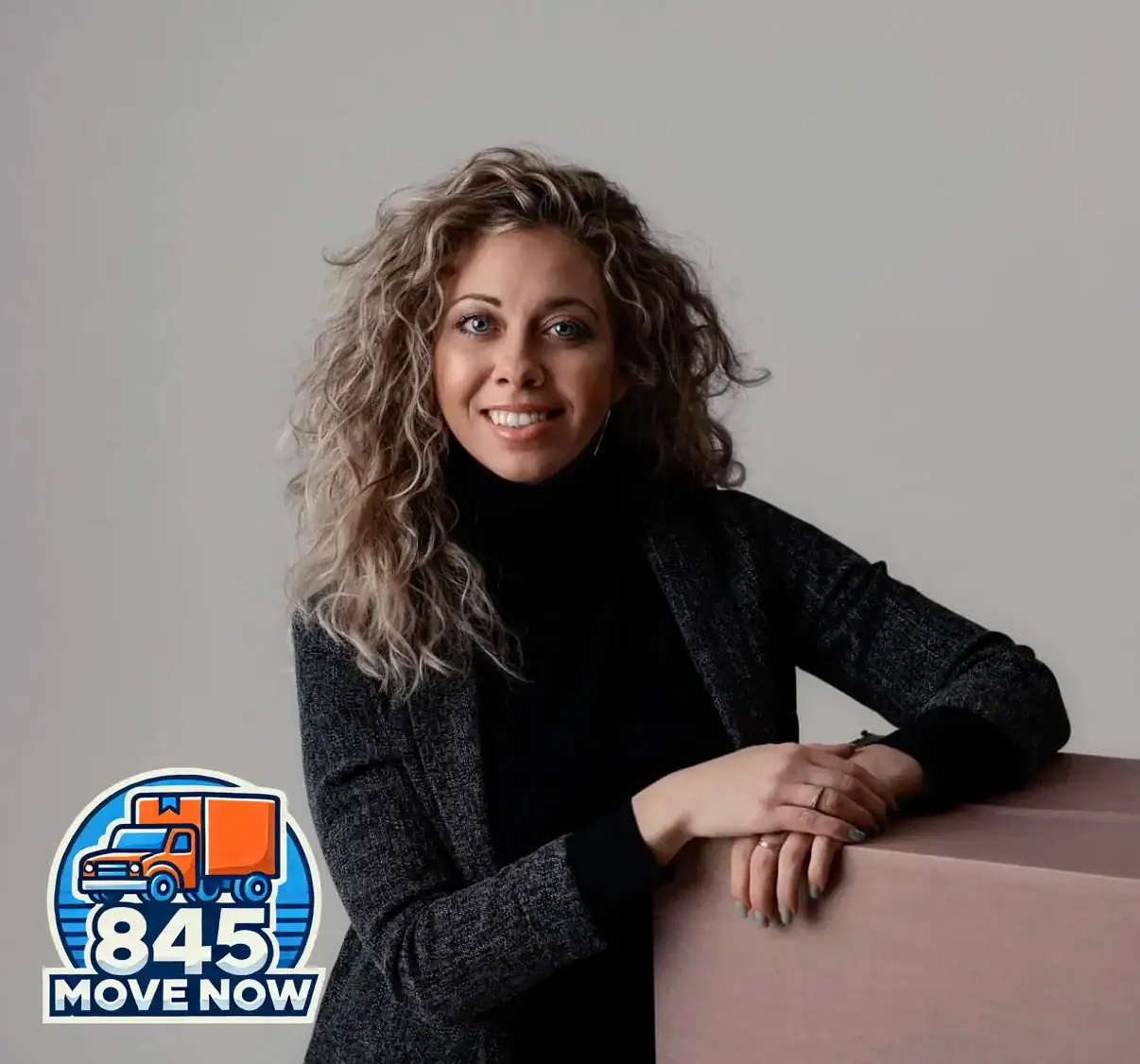 Smiling woman beside moving company 845 Move Now logo